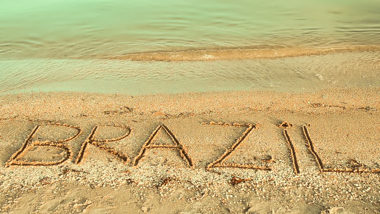 Brasilien inskriptionen i sandet. Inskription i sand, stranden.