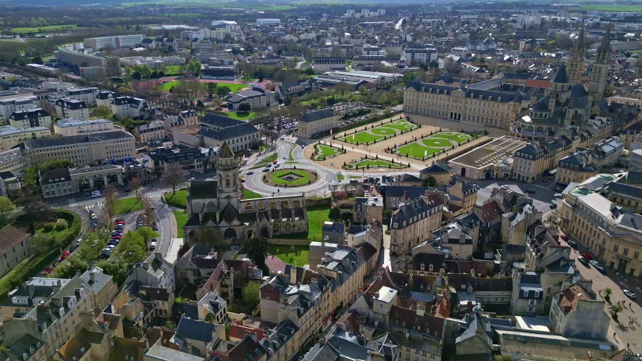Caen town hall, historic Eglise Saint-Étienne-le-Vieux church ruins, Abbaye aux Hommes or Abbey men, cityscape, France. Aerial drone forward and cityscape