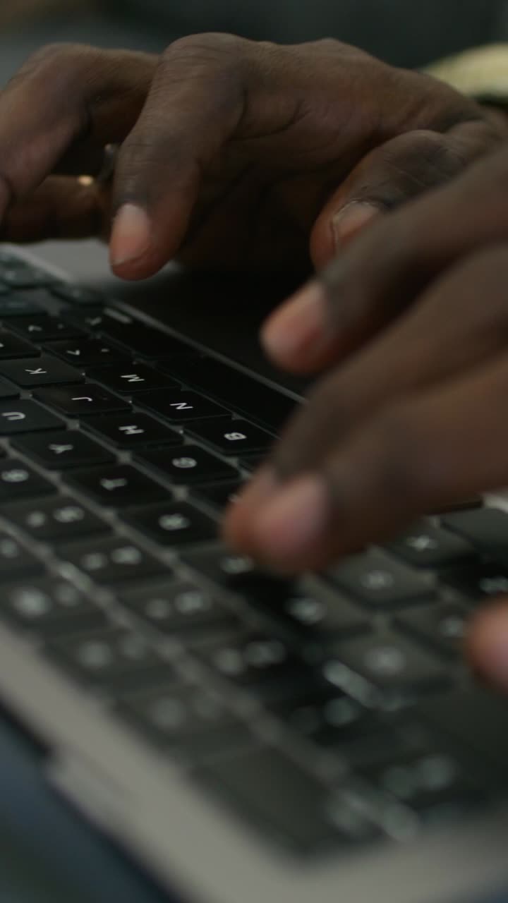 Hands Typing on a Laptop Keyboard