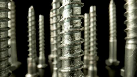 macro close-up of standing metal screws