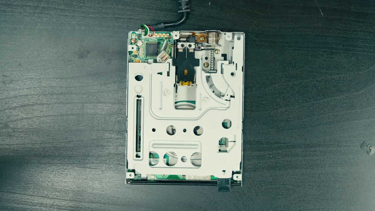 Floppy disc FDD close up, Using diskette for old PC computer macro. Archive programme or Music recorder, playing retro computer games. Vintage device for office, obsolete technology. . High quality 4k footage