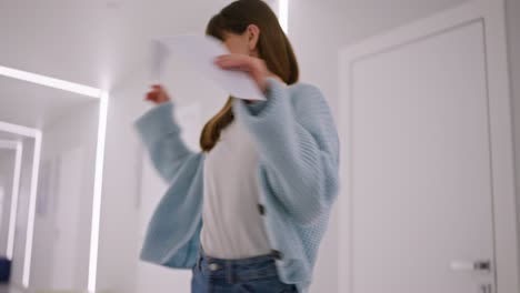 woman dancing in a modern corridor