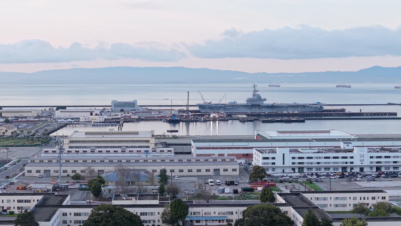 A slow moving shot of the Alameda Naval Base and the surrounding buildings in the area.