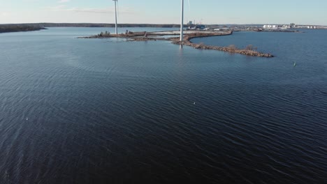 Peaceful-view-of-small-wind-farm-next-to-sea,-Scandinavia,-Aerial-view