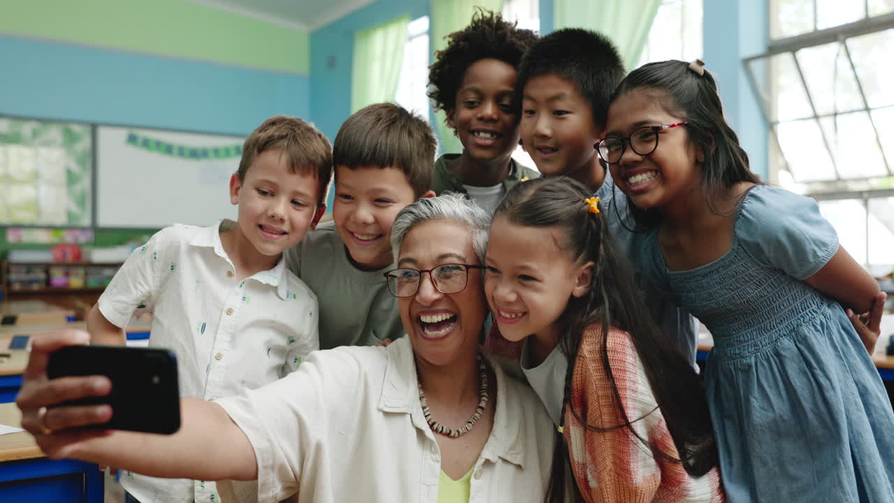 Teacher taking a selfie with her students in the classroom