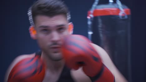 strong and agile male boxer is training. shadow boxing.