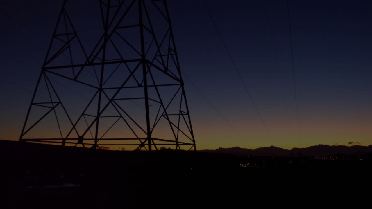 Camera panning over tower silhouette, 3D grid appearing and graphs rising showing data trends