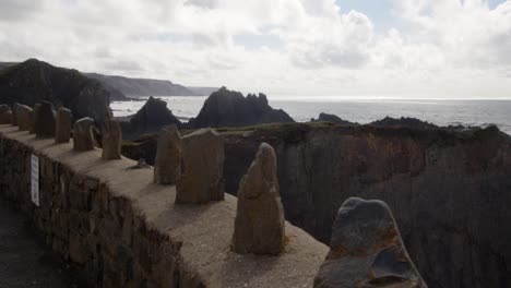 Wide-shot-of-car-park-wall-with-rocks-at-Hartland-Quay,-Stoke,-Hartland,-Bideford