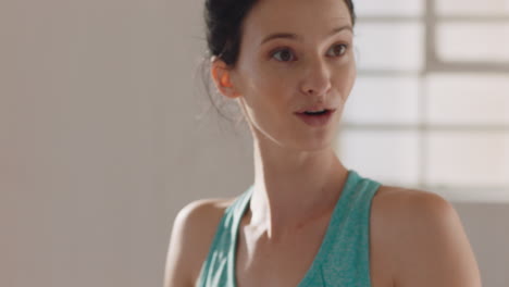 portrait beautiful young caucasian woman chatting to friend in yoga class discussing healthy fitness lifestyle sharing training tips enjoying conversation in studio