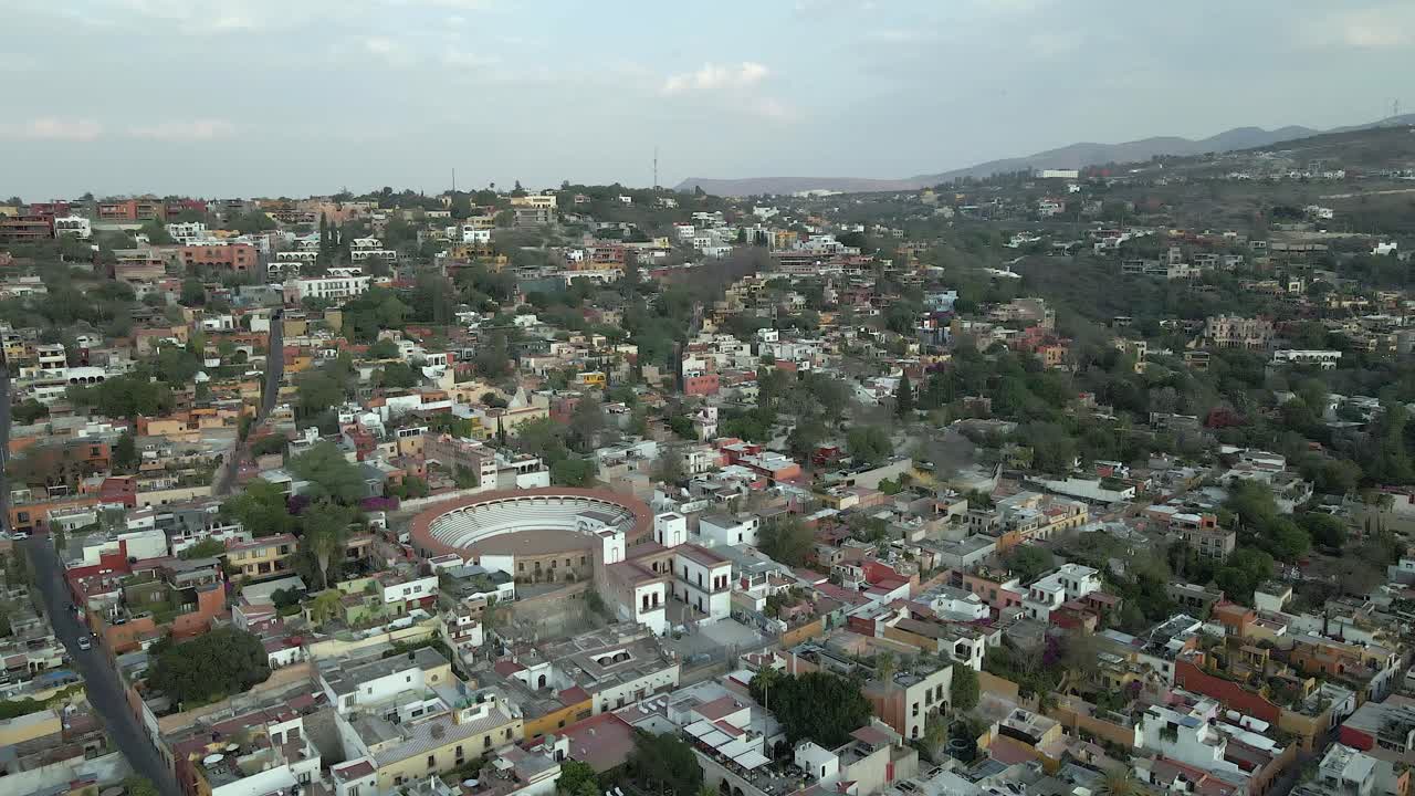 Flyover San Miguel Mexico rooftops to Plaza de Toros bullring arena