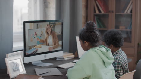 afro kids having online lesson at home