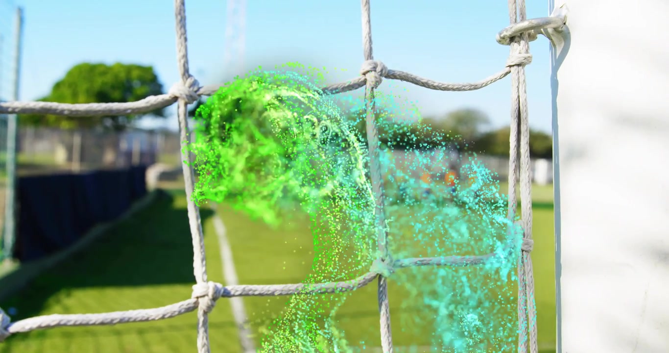 Digital particle swirl appearing in soccer net growing into wave dissolving during soccer training