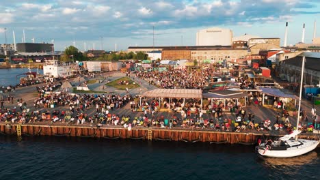 aerial - large crowd of people at reffen street food market, copenhagen
