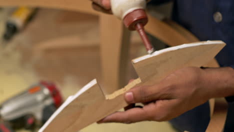 Closeup-Of-Glue-And-Nails-Used-On-A-Wooden-Chair-Frame,-Furniture-Making-Woodwork