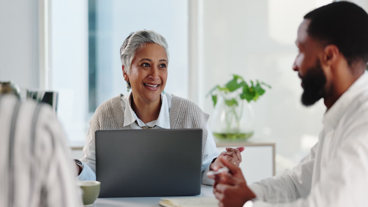 A business meeting in a modern office with a diverse team