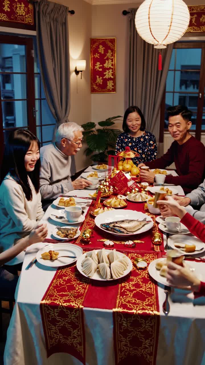 Family celebrating around a festive dinner table, shot from a high angle