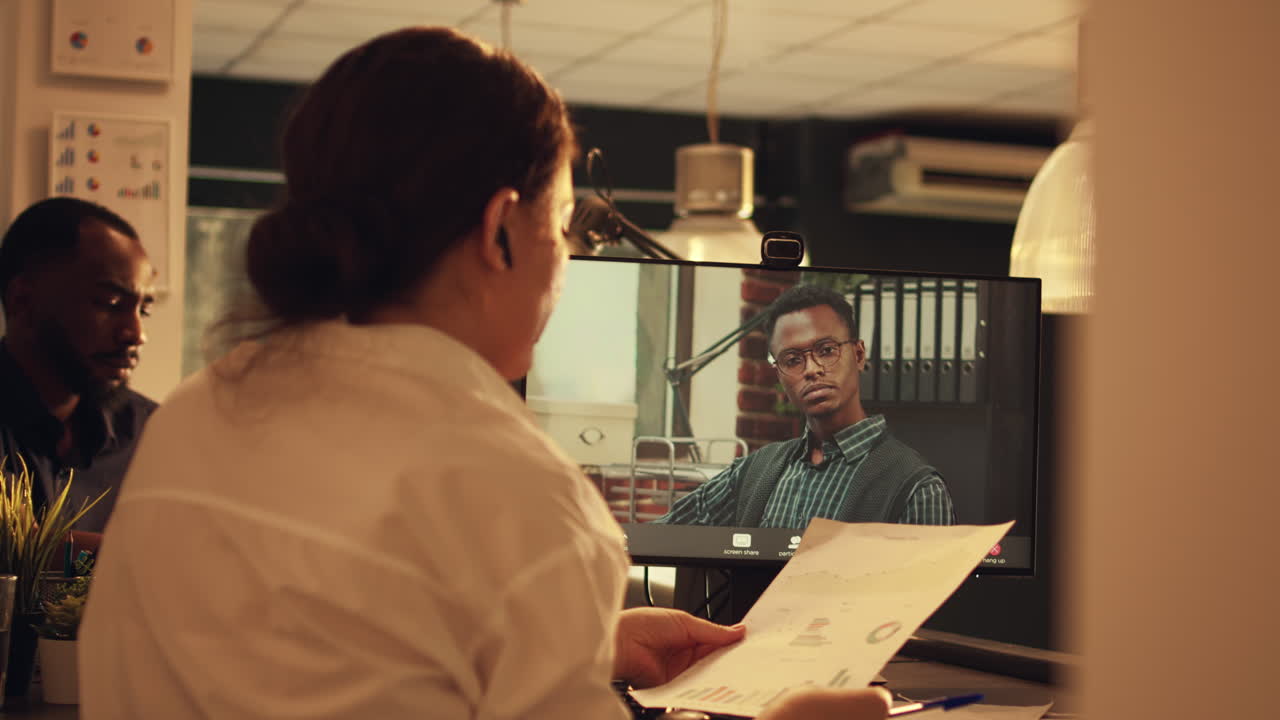 Young adult attending videocall conference with manager