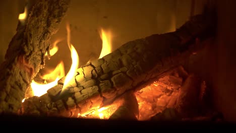 burning log of wood close-up as abstract background