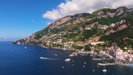 forward drone shot above amalfi, famous beach town on amalfi coast