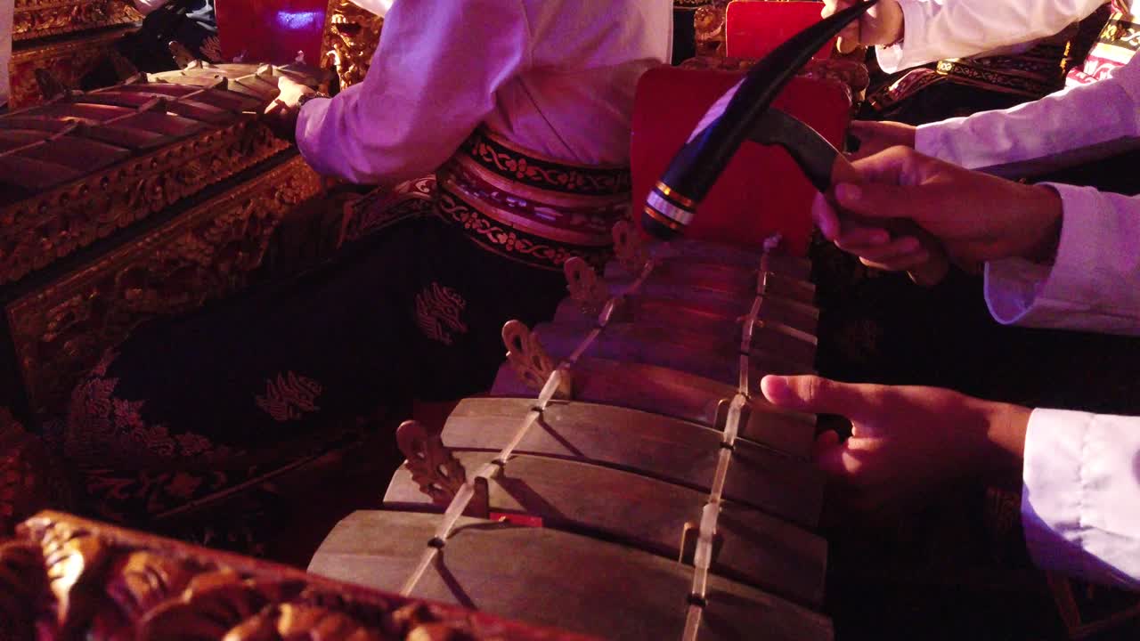 Hands of Gamelan Musicians Playing Rhythmical Music, Bali Indonesia Temple Hindu Religious Ceremony