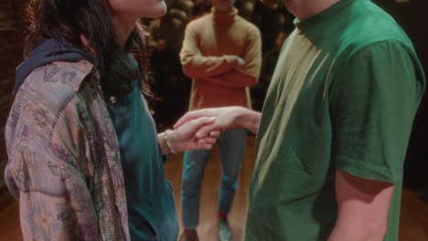 couple of actors doing romantic scene on theater stage