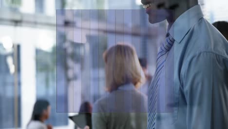 Animation-of-graph-over-smiling-african-american-man-using-smartphone-in-office-foyer