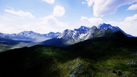 majestic mountain range under a bright blue sky on a sunny day