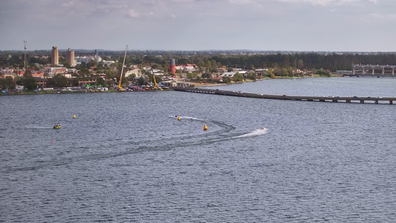 Aerial of an orange racing boat speeding around the E C Griffith Cup 2025 course