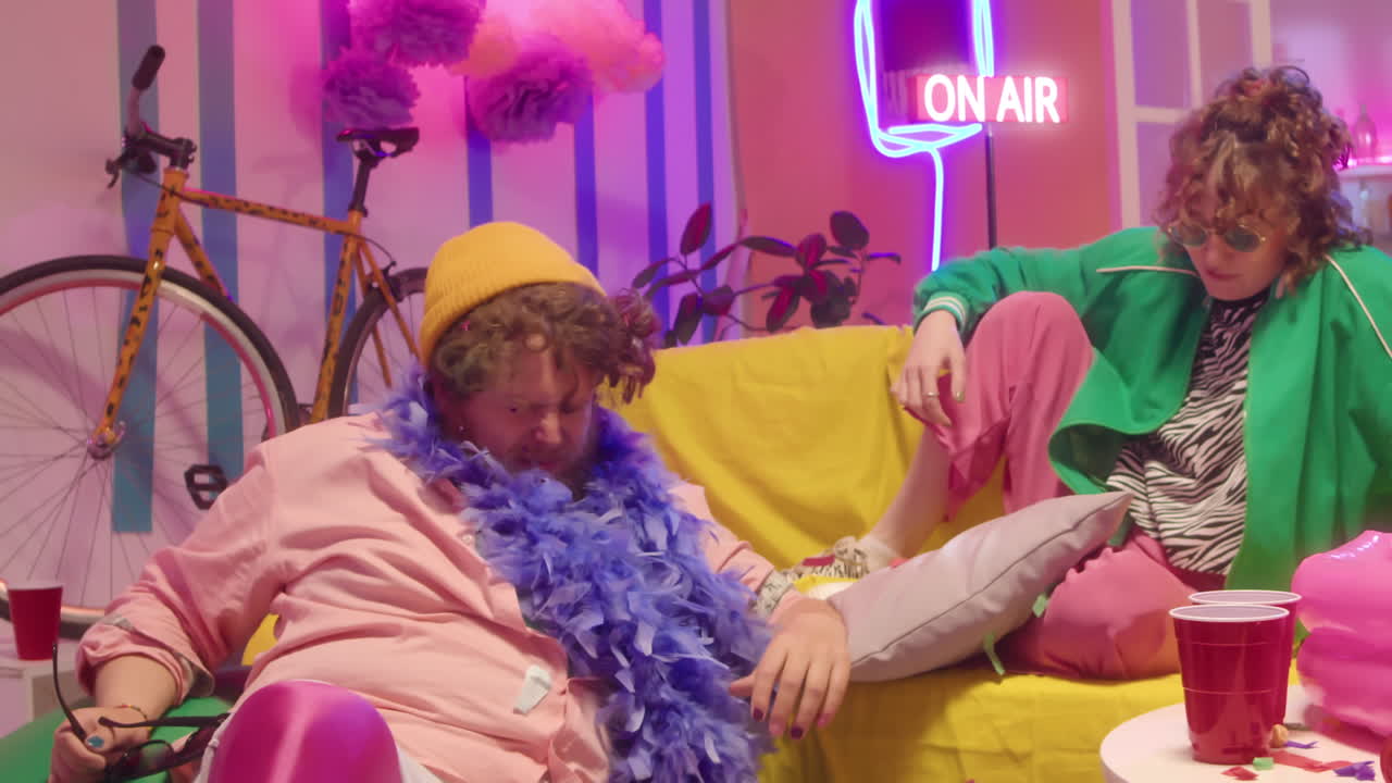 Couple having fun in a brightly lit party room