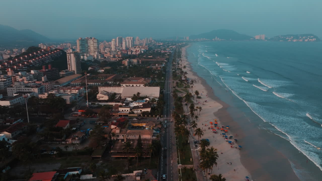 Aerial View of a Coastal City Beachfront at Dusk