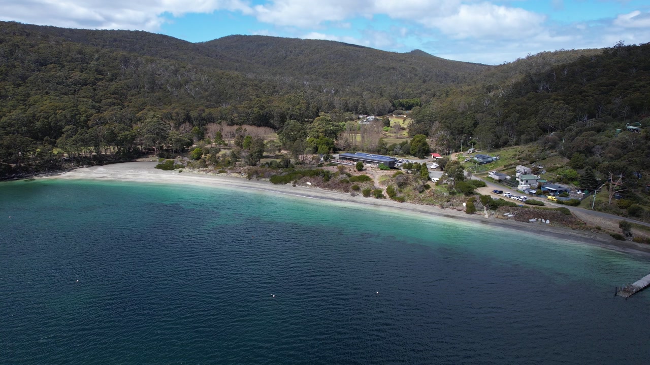 Pristine Sand and Fluted Cape Cliffs of Adventure Bay Beach Walk, Bruny Island, Tasmania, Australia - drone shot