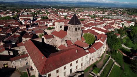 aerial shot around saint andré church in saint just saint rambert city in departement loire, auvergne rhone alpes region, france