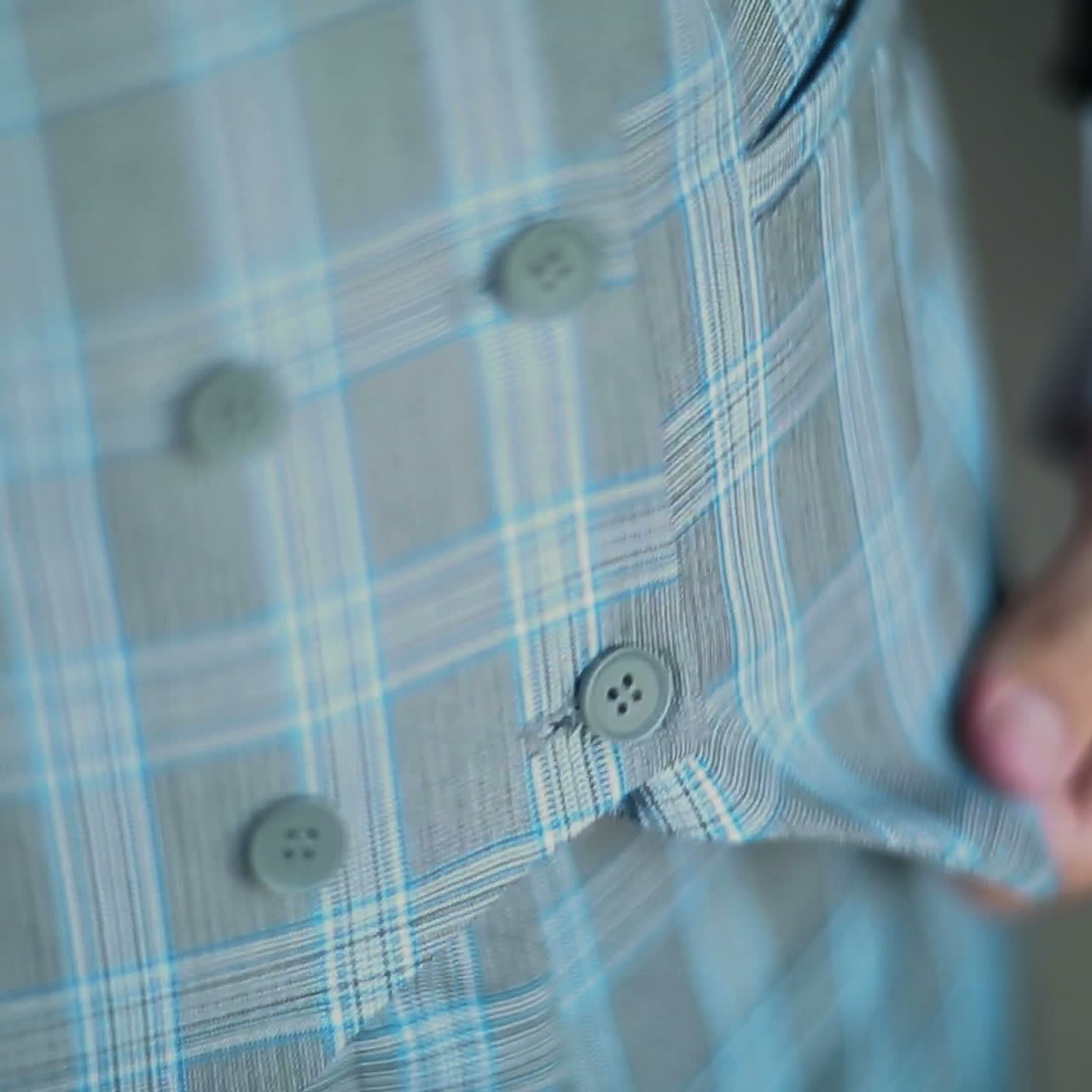 Man fastens buttons on his jacket. Businessman is wearing a jacket. Close up Square video