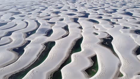 aerial view of white sand dunes and interdunal lagoons