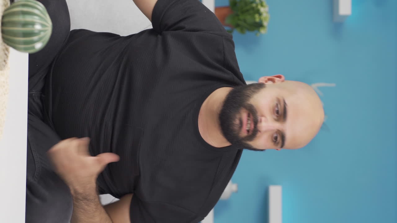 Vertical video of The man who is angry with himself and has faults.