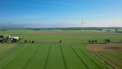 4k aerial shot of wind turbines generating green energy