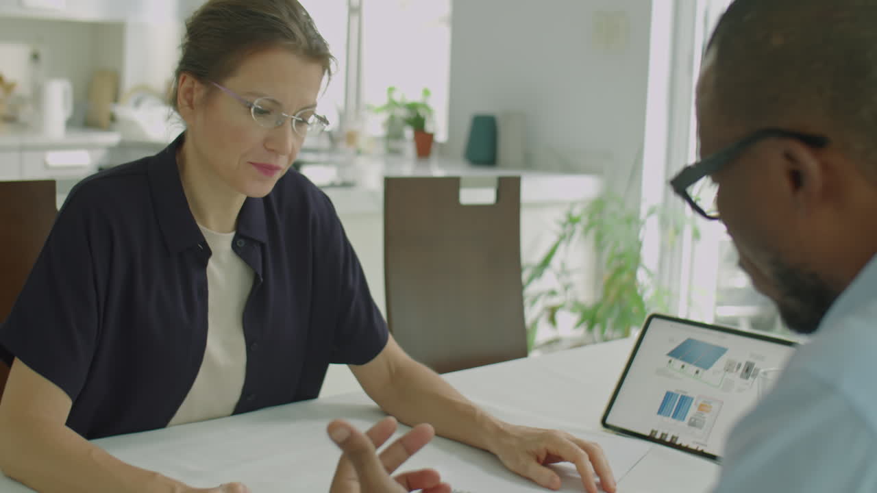 Businesswoman Discussing Project with Male Colleague