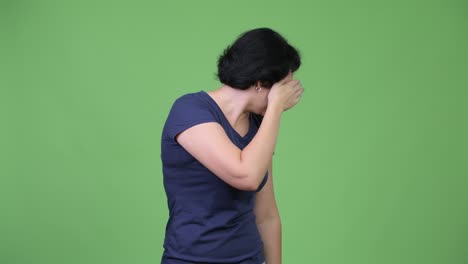 stressed woman covering eyes not wanting to see something