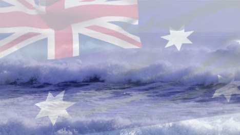 digital composition of australia flag waving against aerial view of waves in the sea