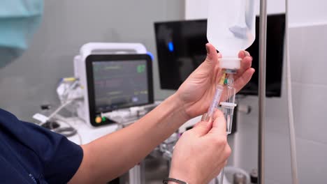 crop veterinarian with syringe filling medical dropper with medicine