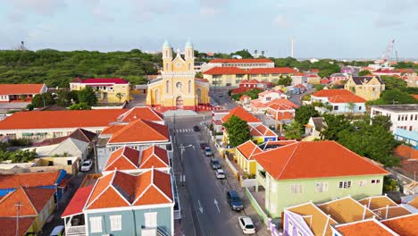 aerial dolly establish santa famia church otrobanda curacao vibrant colorful homes