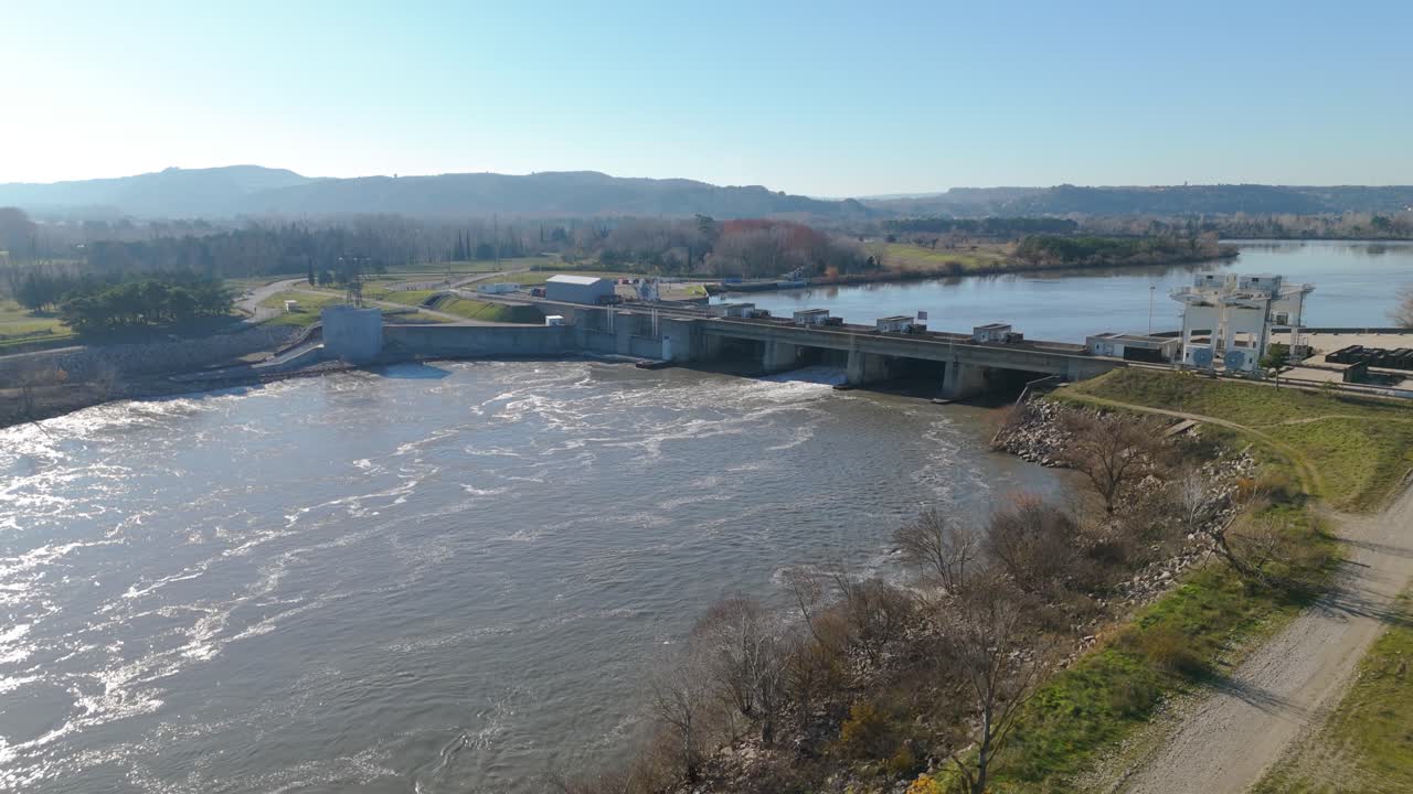 Aerial over the Rhône river with architectural Dam bridge in Avignon, France