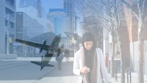 animation of asian woman in hijab walking with smartphone over cityscape