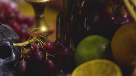 Intriguing-Still-Life:-Human-Skull,-Red-Candle,-and-Enigmatic-Fruit-Arrangement