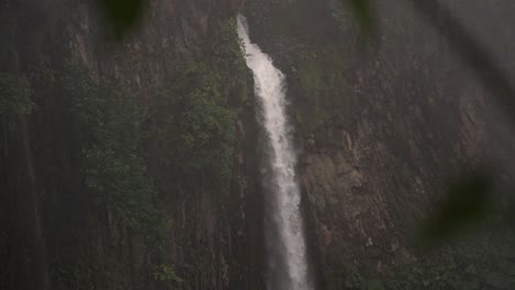 a view of the la catarata del toro waterfall in costa rica, with its impressive cascade of water plunging into a pool
