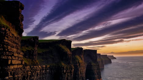 dramatic sunset over the cliffs of moher in ireland