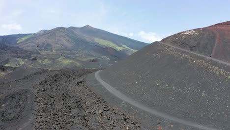 drone flying above and old eruption near etna volcano in italy