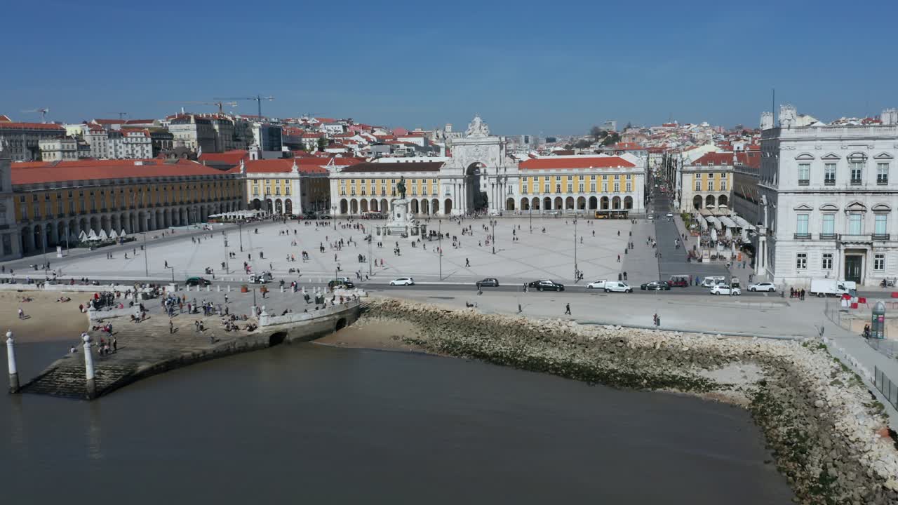 Drone Shot over the Tugas River moving towards the Parco do Comercio in Lisbon, Portugal