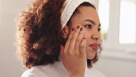 woman applying facial cream