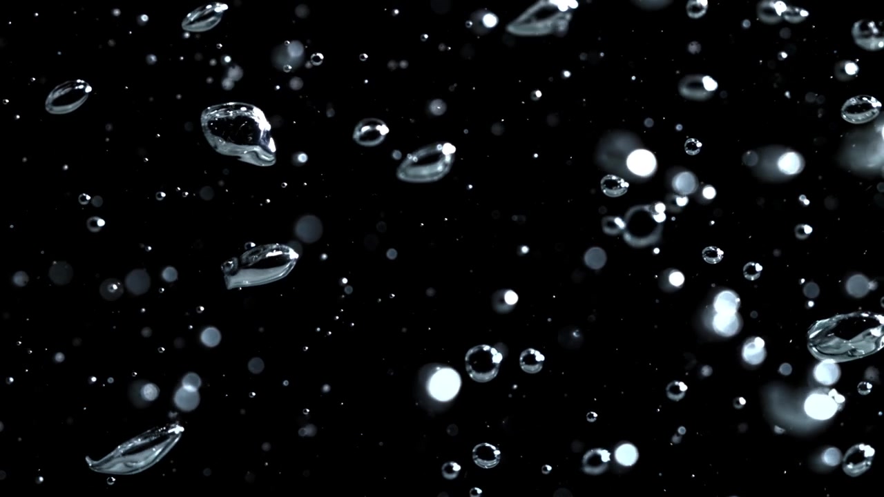 Slow Motion Water Bubbles and Droplets on Black Background